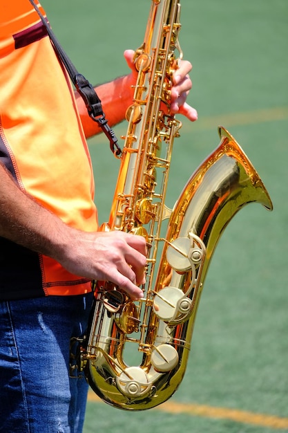 Saxophone classical music instrument saxophonist with alto sax closeup