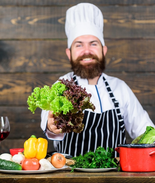 Say no to unhealthy food Happy bearded man chef recipe Dieting organic food Healthy food cooking Mature hipster with beard Vegetarian salad with fresh vegetables Cuisine culinary Vitamin