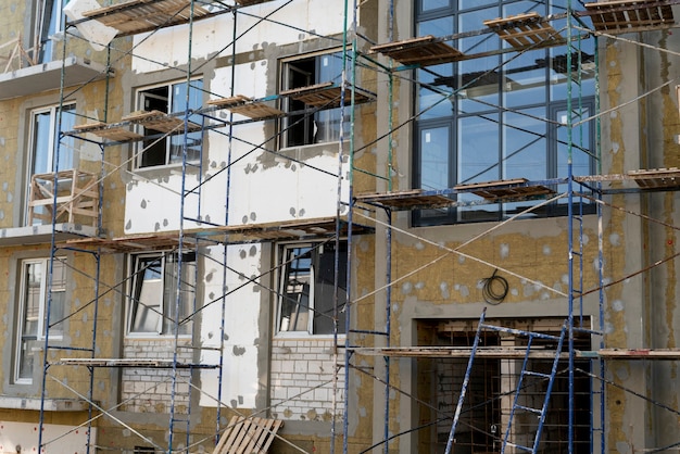 A scaffolding, building construction site, industry work process