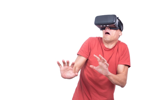 Scared man exploring virtual reality in studio