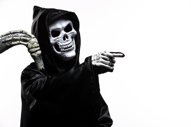 Scary grim reaper in black clothes with scythe on white