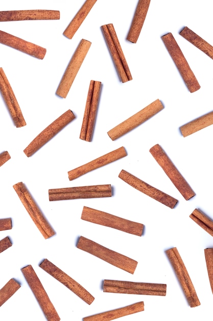 Scattered aromatic cinnamon sticks.