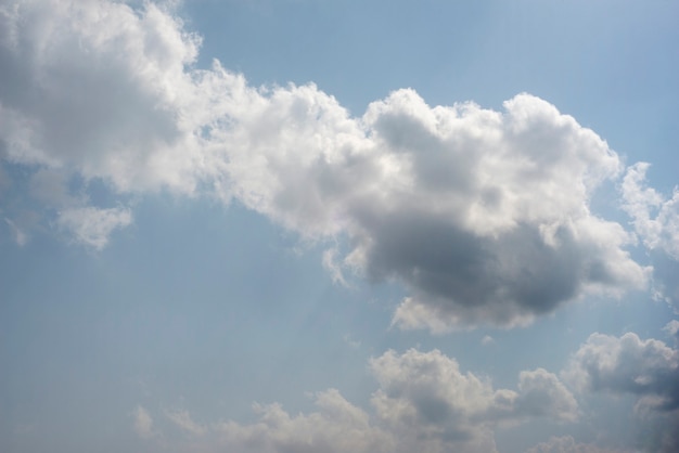 Scattered cloud clusters in a blue sky, blue sky background with white clouds,