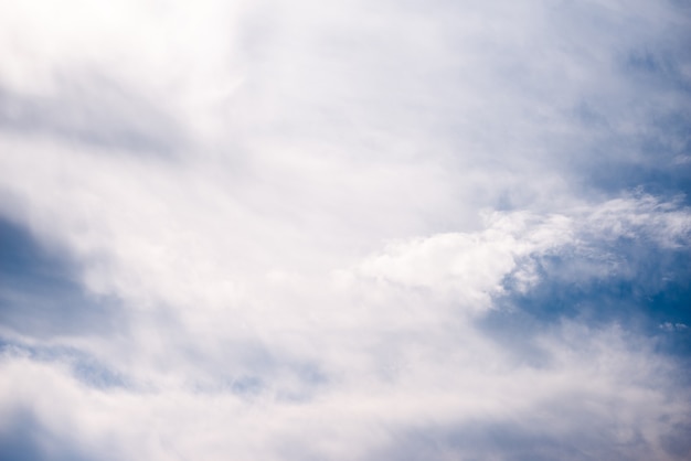 Scattered cloud clusters in a blue sky, blue sky background with white clouds,