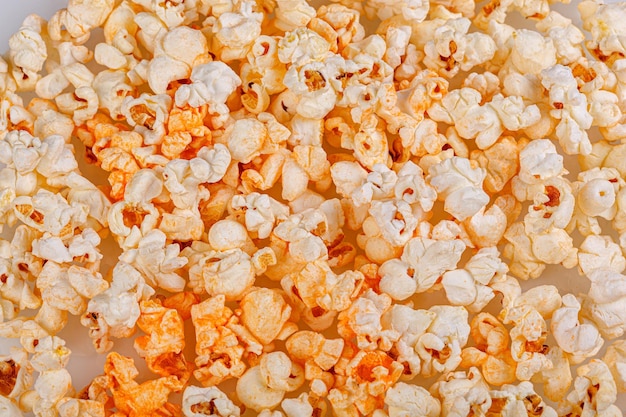 scattered popcorn on a white background closeup