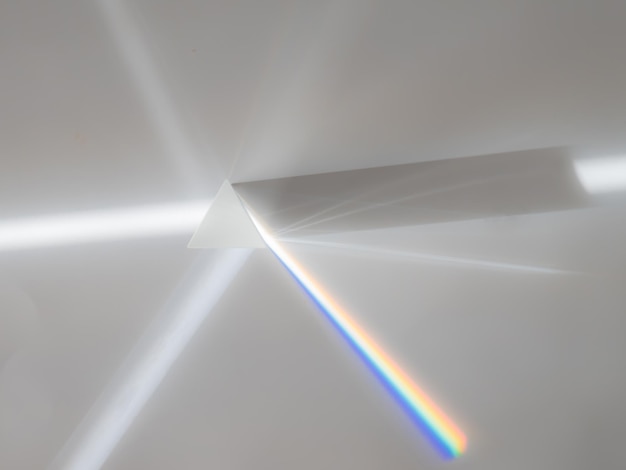 Scattering of a ray of sunlight (white light) through a prism creating refraction, reflection and decomposition of light in the colors of the rainbow