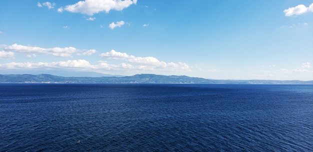 A scene of blue sky and seascape