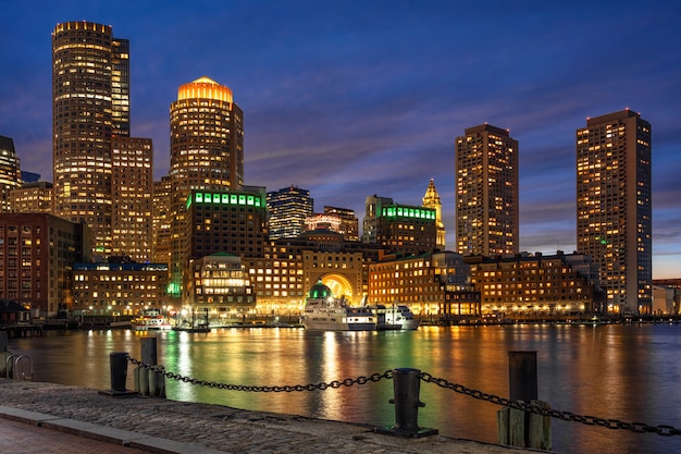 Scene of Boston skyline from Fan Pier at the fantastic twilight time with smooth water river, Massachusetts, USA downtown skyline, Architecture and building with tourist concept