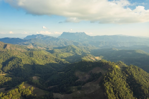 Scenery of Doi Luang Chiang Dao mountain peak with sunlight shining in tropical rainforest on countryside at national park