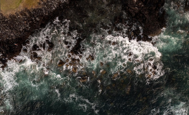 Scenery of rocky shore and wavy sea