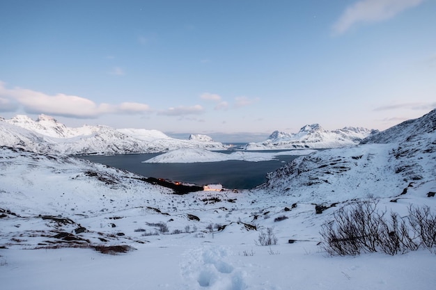 Scenery of snow covered mountain range on winter in arctic ocean at Lofoten islands Norway