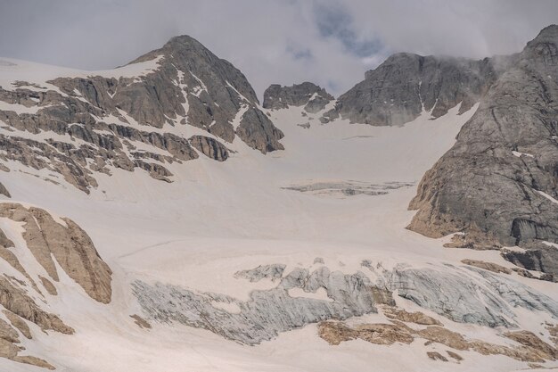 Scenic Alps with white snow on mountain