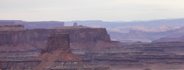 Scenic american landscape and red rock mountains in desert canyon