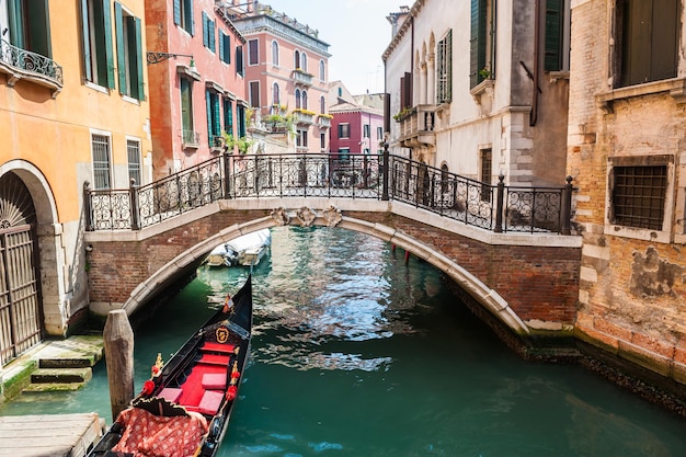 Scenic canal with bridge and colorful buildings in Venice, Italy