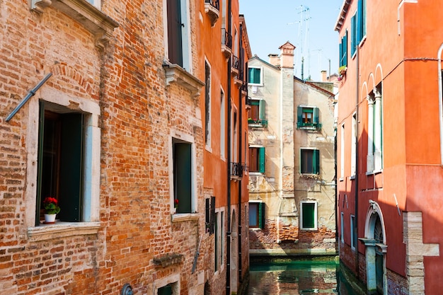 Scenic canal with old architecture in Venice, Italy.