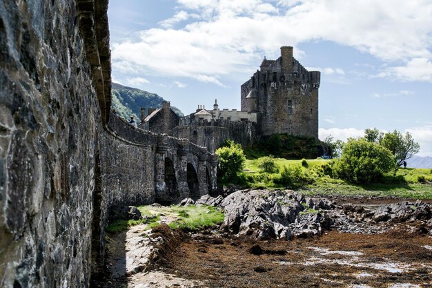 A scenic castle and a footbridge in Scottish Highlands