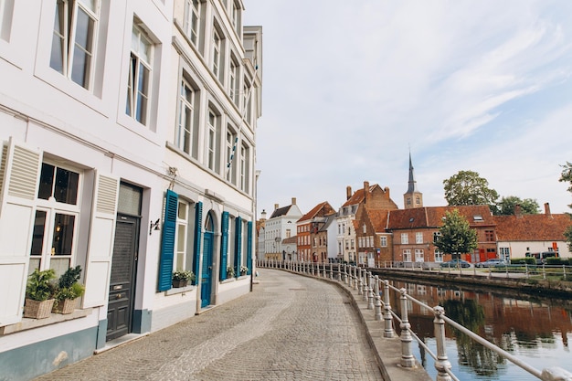 Scenic city view of Bruges canal with beautiful medieval colored houses Belgium