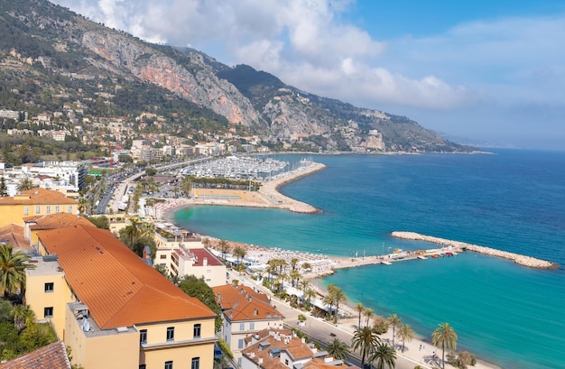 Scenic panoramic view of Menton seashore promenade and historic city in French Riviera Cote D azur