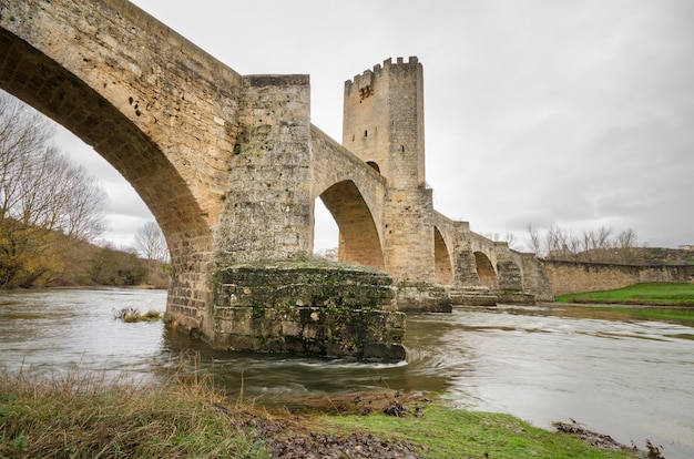 Scenic view of an ancient stone medieval bridge on a cloudy day in Frias, Castilla y Leon, Spain.