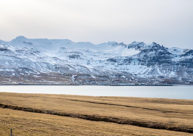 Scenic view around Kirkjufell mountain in winter season under blue sky in north of Iceland