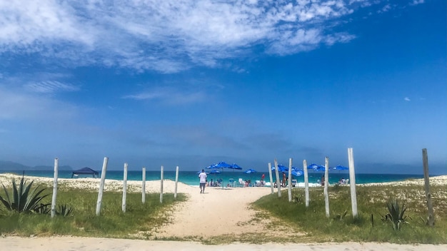 Photo scenic view of beach against blue sky