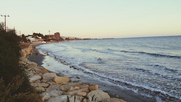 Photo scenic view of beach against clear sky