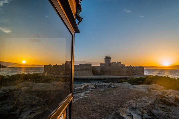 Photo scenic view of buildings against sky during sunset