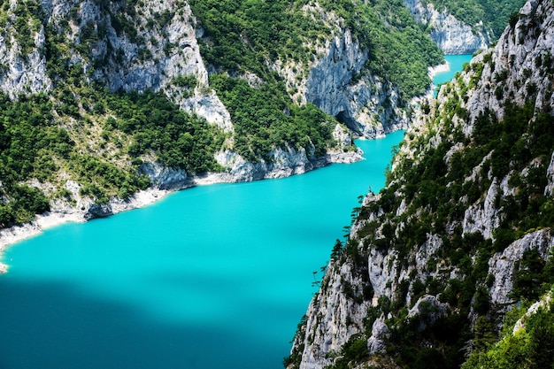 Scenic view on canyon lake piva with mountains in montenegro beautiful landscape shot of nature in n