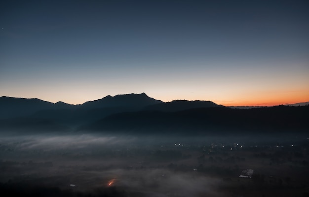 Scenic view of the city covered in mist