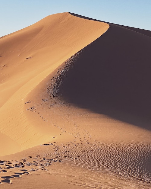 Scenic view of desert against clear sky