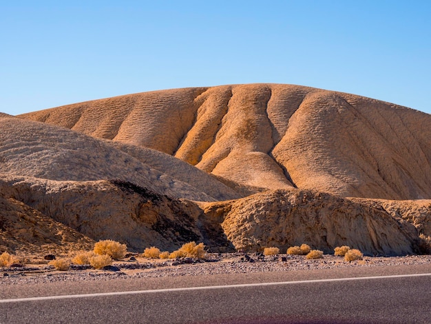 Scenic view of desert against clear sky