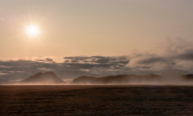 Photo scenic view of desert against sky during sunset