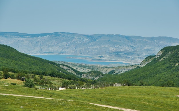 Scenic view of green meadows big mountain Dagestan