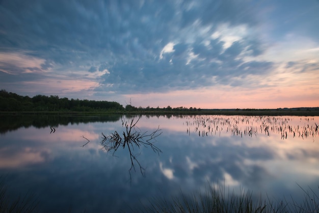 Scenic view of lake against sky during sunset