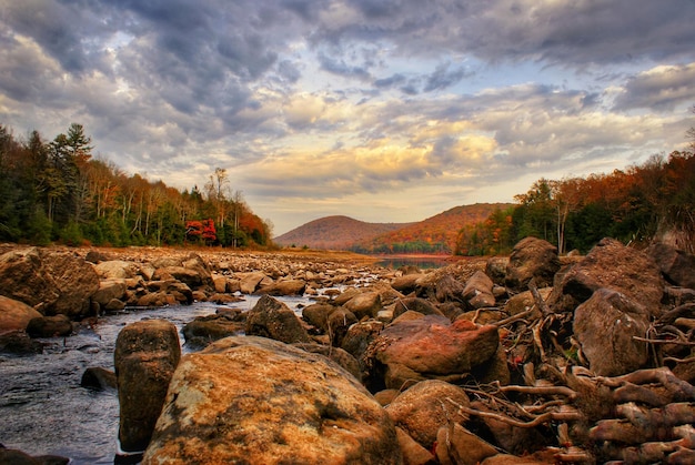 Photo scenic view of landscape against sky during sunset