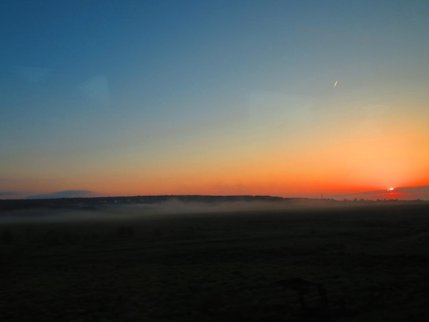 Scenic view of landscape against sky during sunset