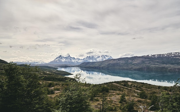 Scenic view of mountains against cloudy sky