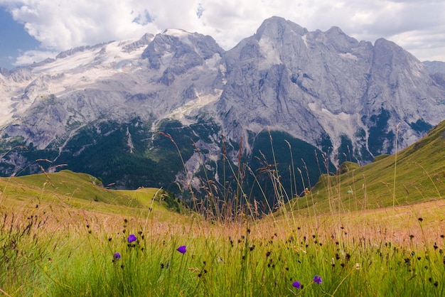 Scenic view of mountains against cloudy sky