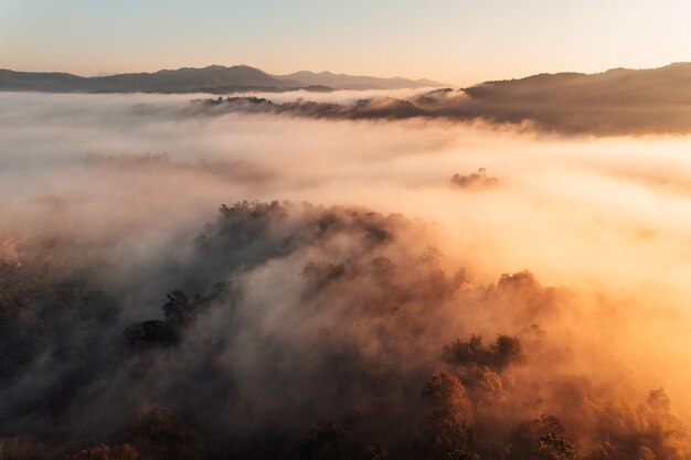 Photo scenic view of mountains against sky during sunset