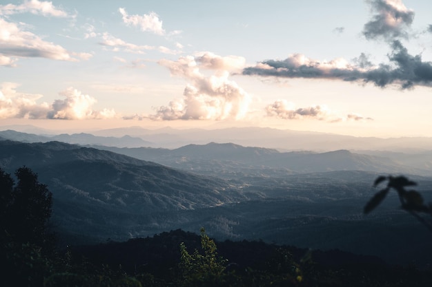 Scenic View Of Mountains Against Sky During Sunset