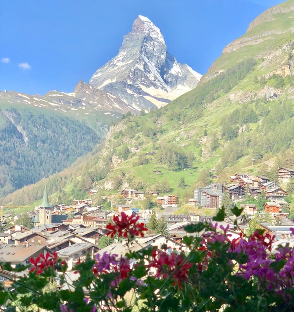 Scenic view of mountains and buildings against sky