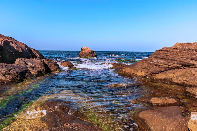 Photo scenic view of sea against clear blue sky