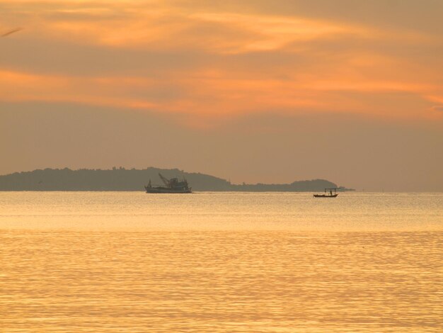 Scenic view of sea against orange sky