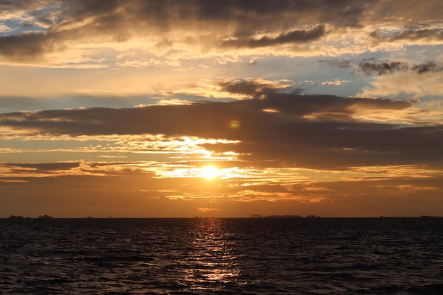 Scenic view of sea against sky during sunrise