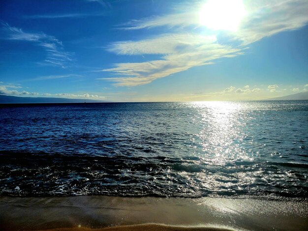 Photo scenic view of sea against sky during sunset