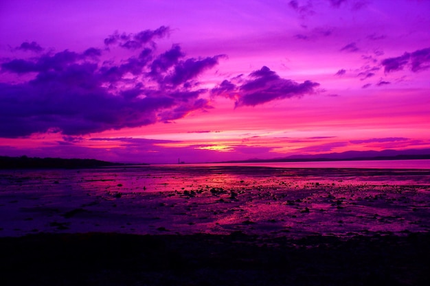 Photo scenic view of sea at sunset