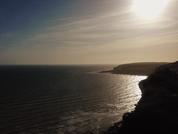 Photo scenic view of sea at sunset