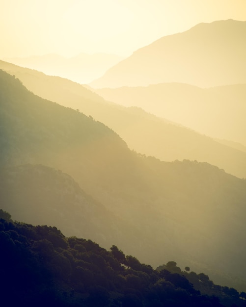 Scenic view of silhouette mountains against sky during sunset