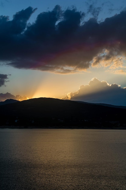 Scenic view of silhouette mountains against sky at sunset