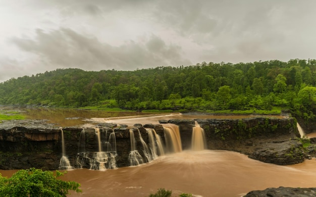 Scenic view of waterfall against sky